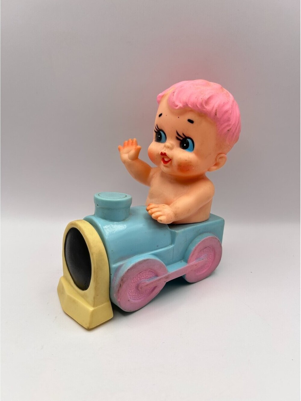 Vintage Blinky Squeak Toy Baby in Train Engine Pastel 1950s